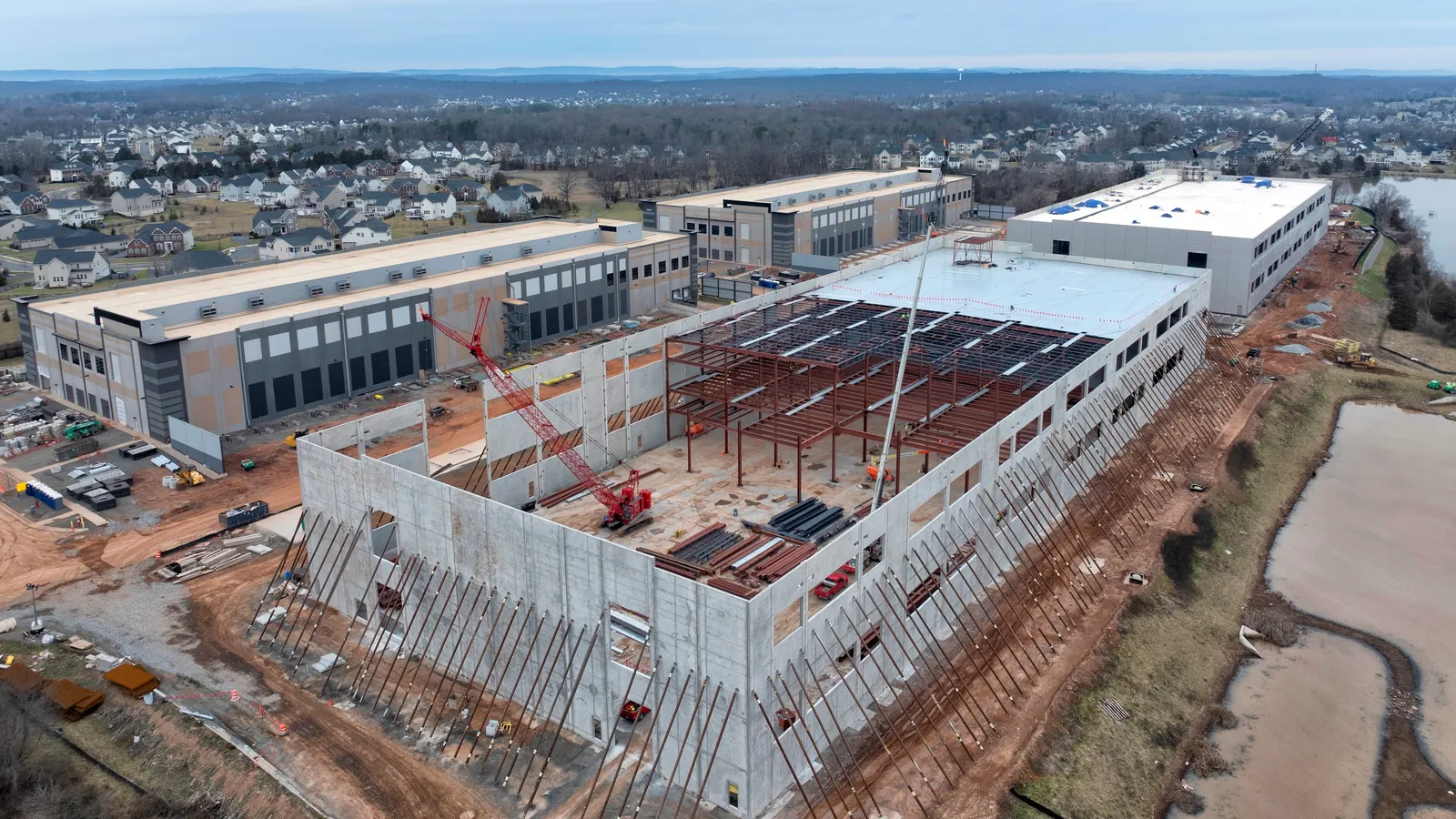Data center construction professional reviewing project status on a tablet